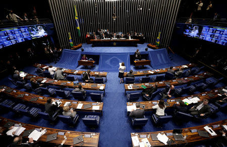 Members of Brazil's Senate, in favor and against the impeachment of President Dilma Rousseff, participate in the debate leading up to the voting in Brasilia, Brazil, May 11, 2016. REUTERS/Ueslei Marcelino