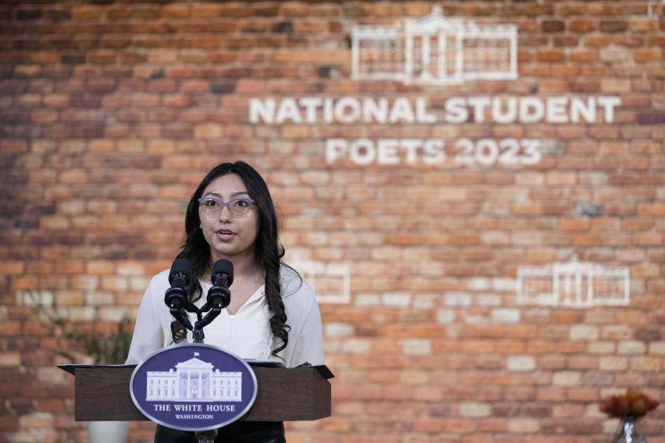 Jacqueline Flores of Fort Meade, Fla., and a 2023 National Student Poets reads her poem during and event with first lady Jill Biden in the South Court Auditorium on the White House complex in Washington, Monday, Nov. 13, 2023. (AP Photo/Susan Walsh)