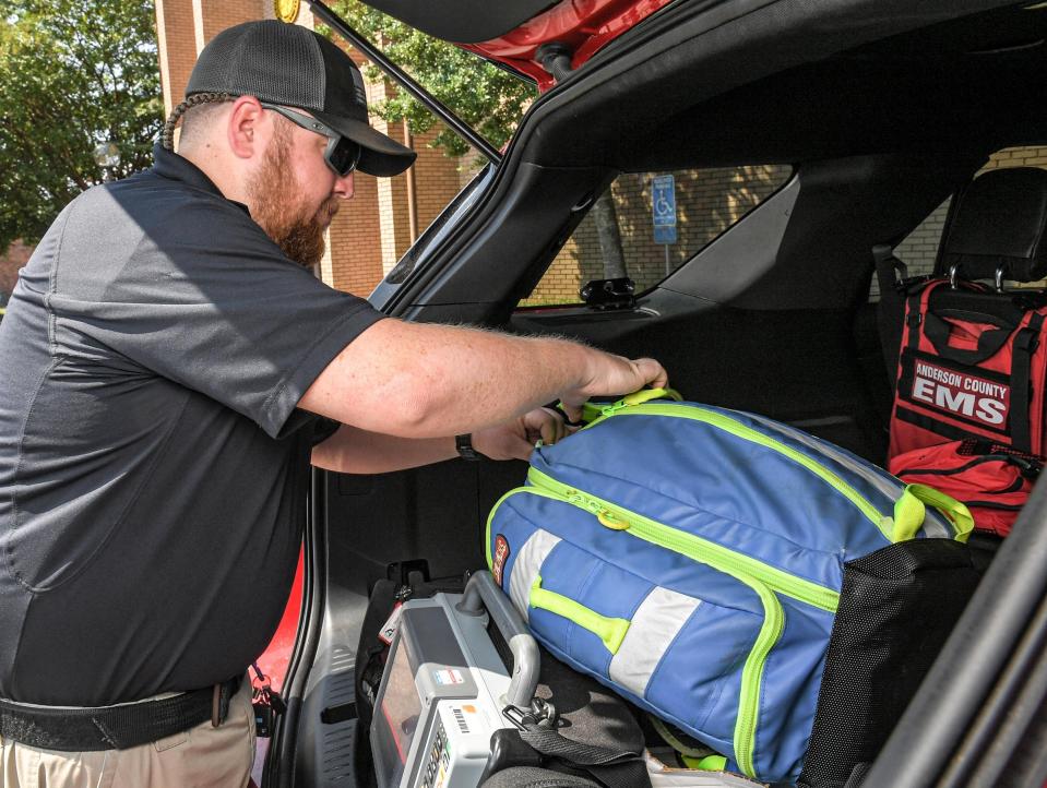 Mac Hornsby, an Anderson County paramedic looks over equipment in the 2020 Ford Expedition, a quick response vehicle equipped like an ambulance without being able to carry a patient to a hospital. A new plan begins September 1 with 17 ambulances and 14 quick response vehicles. Medshore is working with Anderson County hiring Emergency Medical Technicians and paramedics that are currently working in the county.