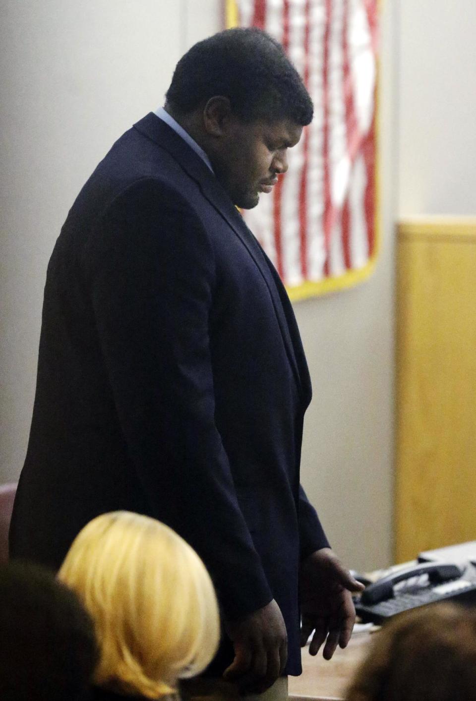 Former Dallas Cowboys Josh Brent bows his head as he walks into court during the penalty phase of the intoxication manslaughter trial in Dallas, Thursday, Jan. 23, 2014. Brent was found guilty on Wednesday, of intoxication manslaughter and faces probation to 20 years for a fiery wreck that killed his teammate and close friend Jerry Brown. (AP Photo/LM Otero)