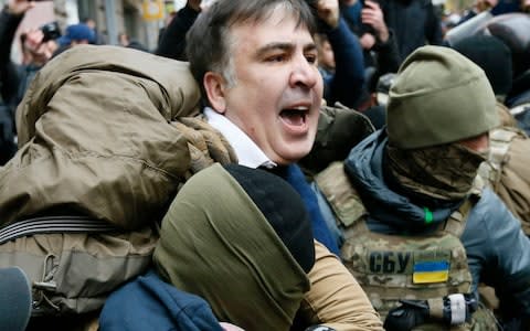 Mr Saakashvili is detained by agents of the security service of Ukraine. - Credit: Valentyn Ogirenko/Reuters