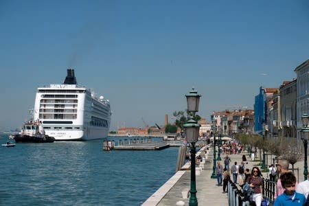 The cruise ship MSC Opera loses control and crashes against a smaller tourist boat at the San Basilio dock in Venice