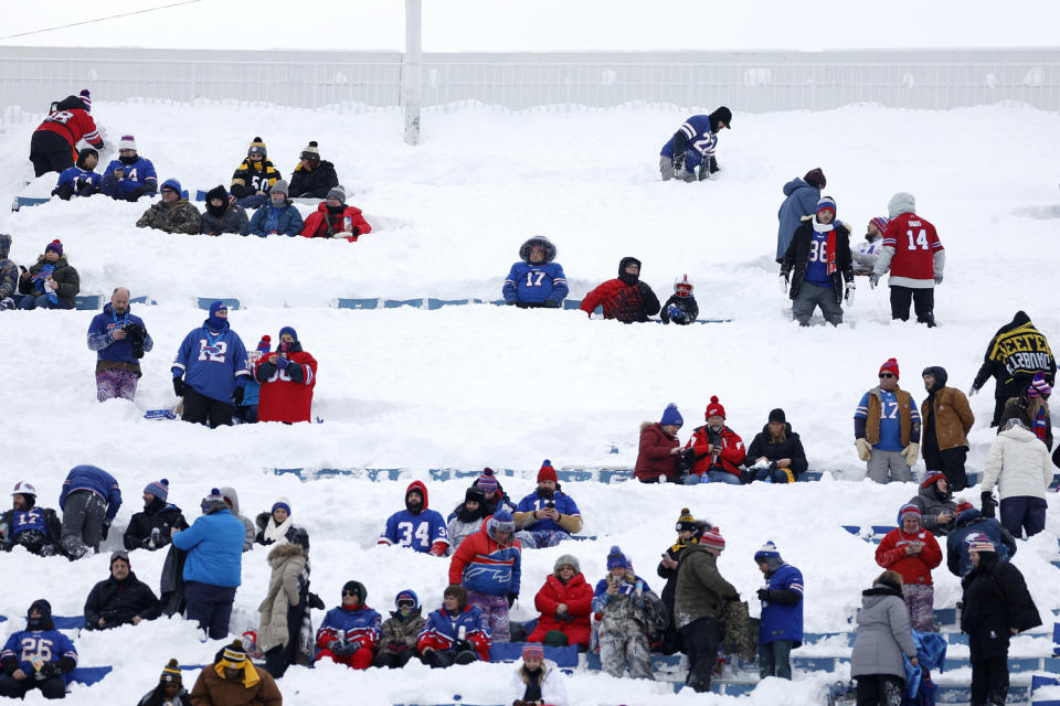 Fans take their seats in the snow before the game between the Buffalo Bills and the Pittsburgh Steelers. (Sarah Stier / Getty Images)