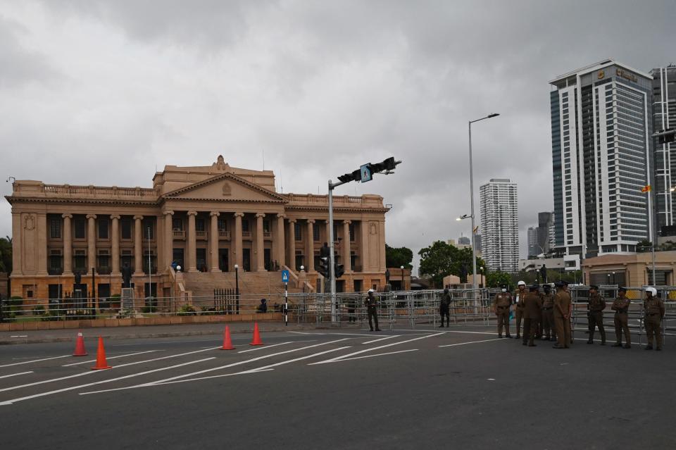 Police and army personnel stand guard in front of the Presidential Secretariat in Colombo on July 23, 2022.