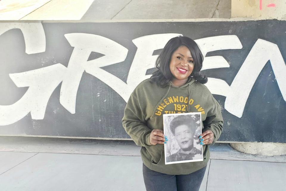 Tiffany Crutcher holding a photo of her great-grandmother.