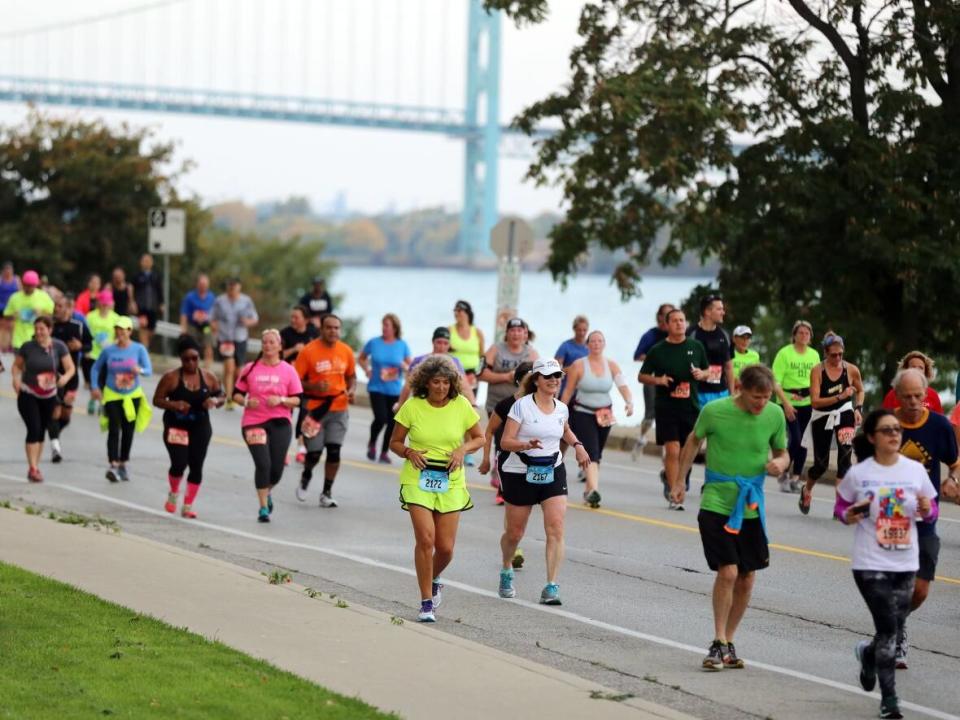 Runners make their way along Riverside Drive in Windsor, Ontario during  the 39th Annual Detroit Free Press/Talmer Bank Marathon in Detroit Sunday, Oct. 16, 2016. For this year's run, participants will be required to fill out the ArriveCAN app before entering Canada.   (Regina H. Boone/Detroit Free Press - image credit)