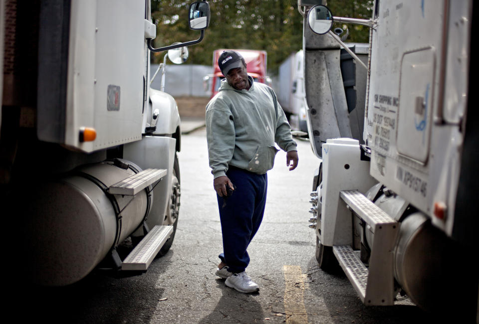 Truck driver pay is surprisingly low, given the need for drivers. (AP Photo/David Goldman)