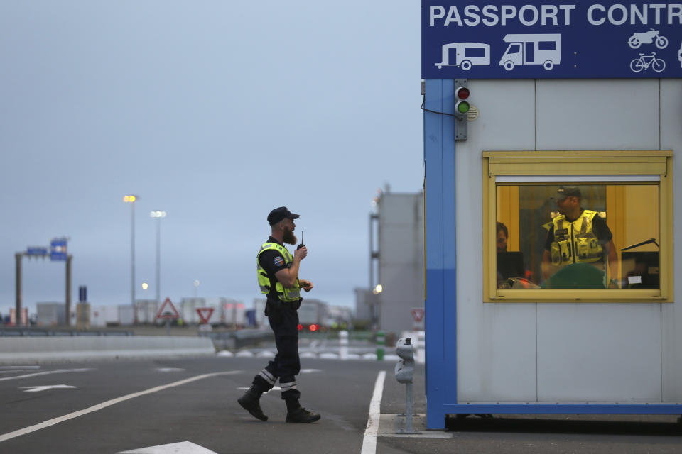 French custom officers work at the transit zone at the port of Ouistreham, Normandy, Thursday, Sept.12, 2019. France has trained 600 new customs officers and built extra parking lots arounds its ports to hold vehicles that will have to go through extra checks if there is no agreement ahead of Britain's exit from the EU, currently scheduled on Oct. 31. (AP Photo/David Vincent)