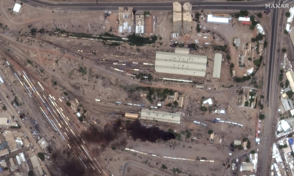 This satellite image provided by Maxar Technologies shows fires and smoke at Khartoum railway, Sudan, Sunday April 16, 2023. The Sudanese military and a powerful paramilitary group are battling for control of the chaos-stricken nation for a second day. (Satellite image ©2023 Maxar Technologies via AP)