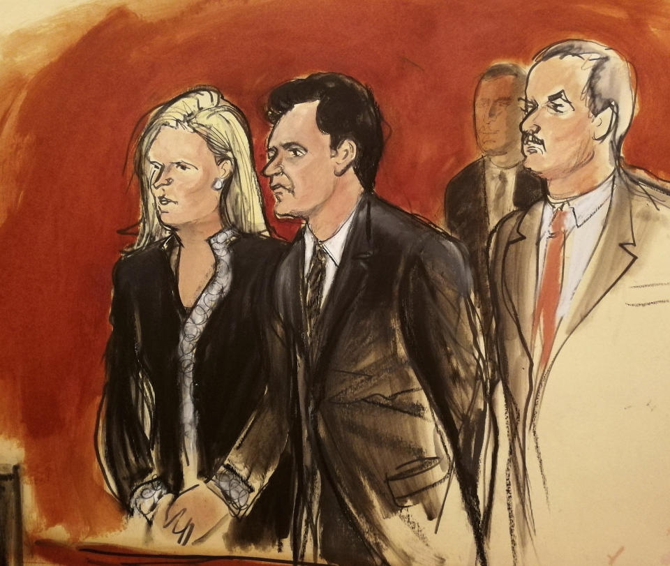 FILE - In this Wednesday, May 16, 2018 file courtroom sketch, Mehmet Hakan Atilla, second left, listens to the judge during his sentencing, flanked by his attorneys Cathy Fleming, left, and Victor Rocco in New York. U.S. District Judge Richard Berman imposed a sentence of 32 months in prison on the Turkish banker convicted of helping Iran evade U.S. sanctions. Turkey has criticised the case against Atilla, an official at Turkey's state-controlled Halkbank. (Elizabeth Williams via AP, File)
