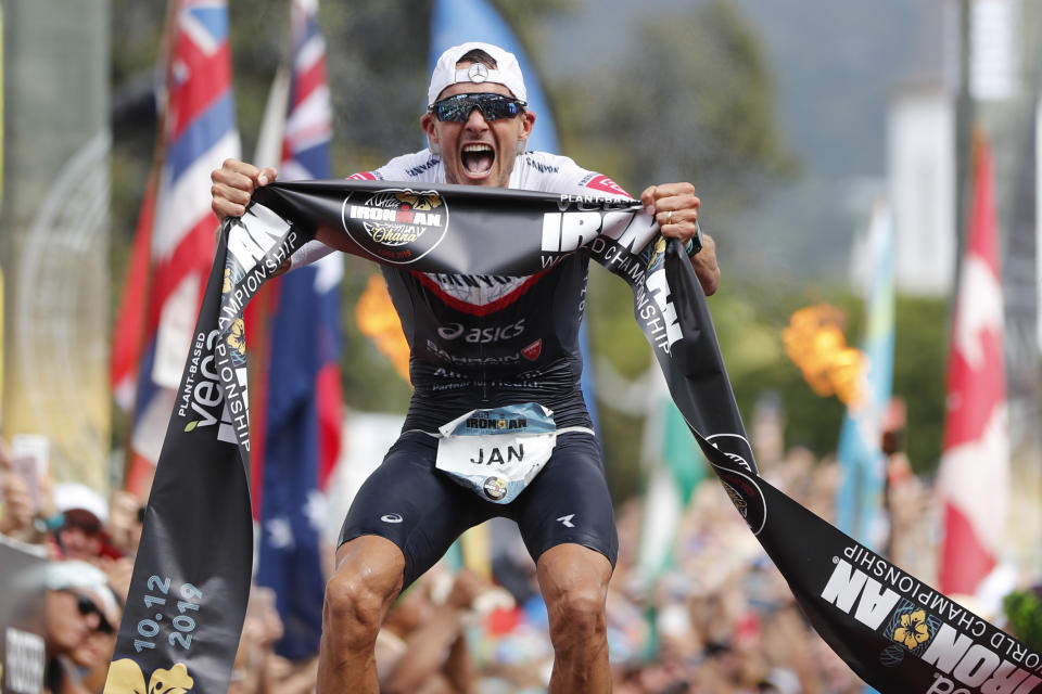 FILE - In this Oct. 12, 2019, file photo Jan Frodeno, of Germany, reacts after winning the Ironman World Championship Triathlon, in Kailua-Kona, Hawaii. The Ironman World Championship will be held outside Hawaii for the first time in four decades because of uncertainty over whether the Big Island will be able to host the triathlon as scheduled in February during the coronavirus pandemic. Competitors will instead head to St. George, Utah, on May 7. (AP Photo/Marco Garcia, File)