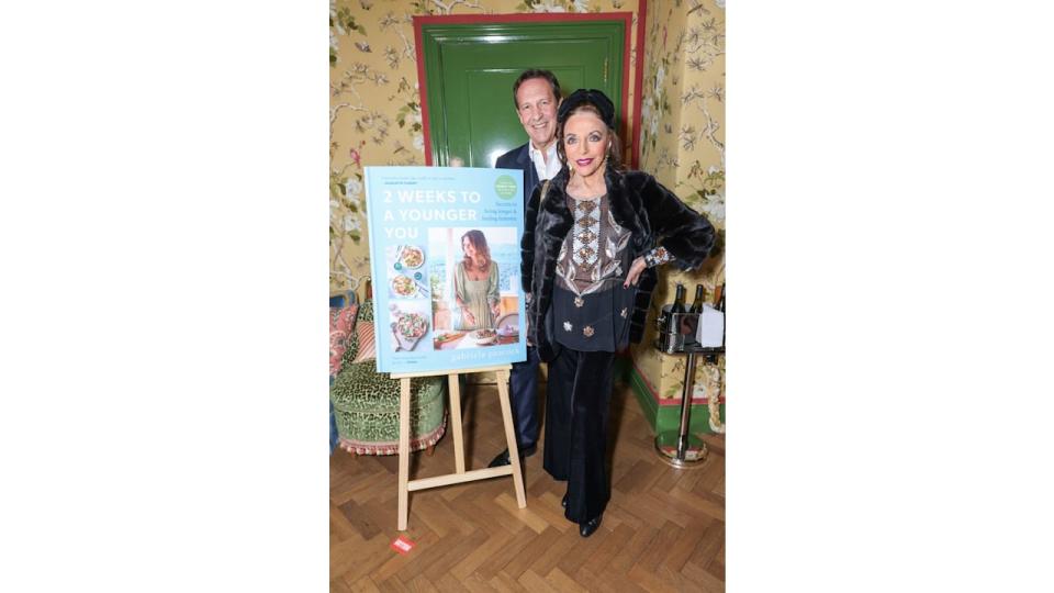 Percy Gibson and Dame Joan Collins  attend a special event celebrating the success of nutraceutical expert Gabriela Peacock's best-selling second book, "2 Weeks to A Younger You" and the relaunch of her Longevity Range, at the Broadwick Soho Hotel on April 23, 2024 in London, England. (Photo by Dave Benett/Getty Images for Gabriela Peacock)