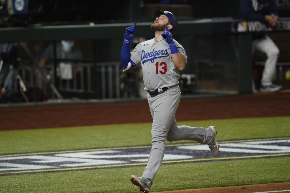 Los Angeles Dodgers first baseman Max Muncy celebrates a home run against the Tampa Bay Rays during the fifth inning in Game 5 of the baseball World Series Sunday, Oct. 25, 2020, in Arlington, Texas. (AP Photo/Eric Gay)