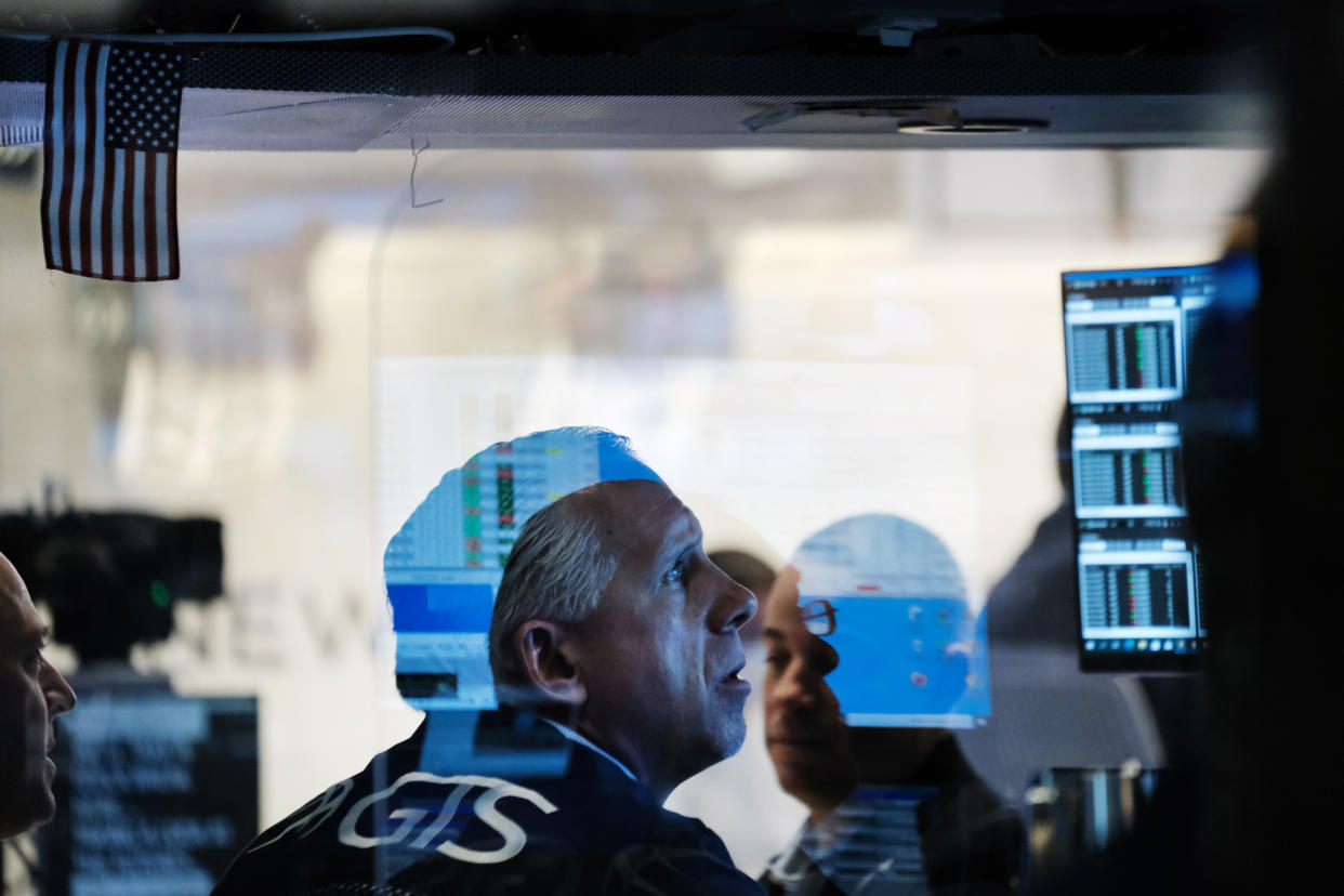 NEW YORK, NEW YORK - NOVEMBER 29: A trader works on the floor of the New York Stock Exchange (NYSE) at the start of trading on Monday following Friday’s steep decline in global stocks over fears of the new omicron Covid variant discovered in South Africa on November 29, 2021 in New York City. Stocks surged in morning trading as investors get more data on the new variant and reports that symptoms have so far been mild for those who have contracted it.  (Photo by Spencer Platt/Getty Images)