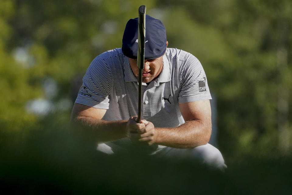 Bryson DeChambeau, of the United States, lines up a putt on the 14th green during the final round of the US Open Golf Championship, Sunday, Sept. 20, 2020, in Mamaroneck, N.Y. (AP Photo/John Minchillo)