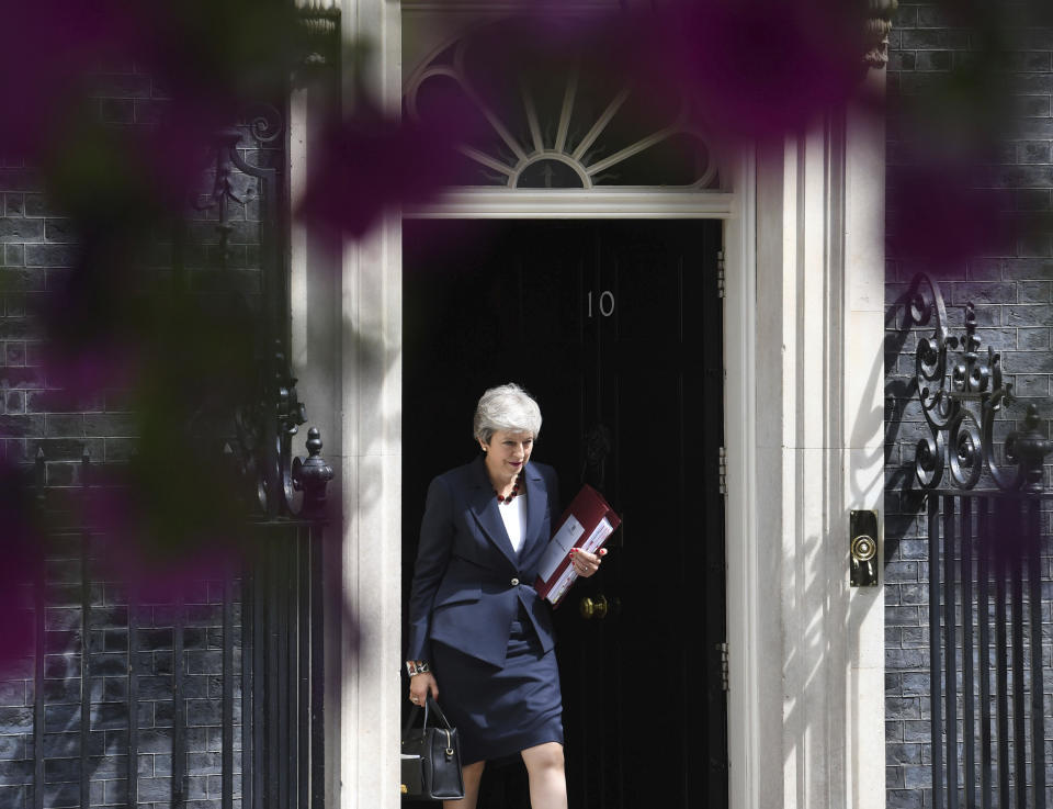 Britain's Prime Minister Theresa May leaves 10 Downing Street, for the House of Commons to attend Prime Minister's Questions, in London, Wednesday July 17, 2019. (Stefan Rousseau/PA via AP)