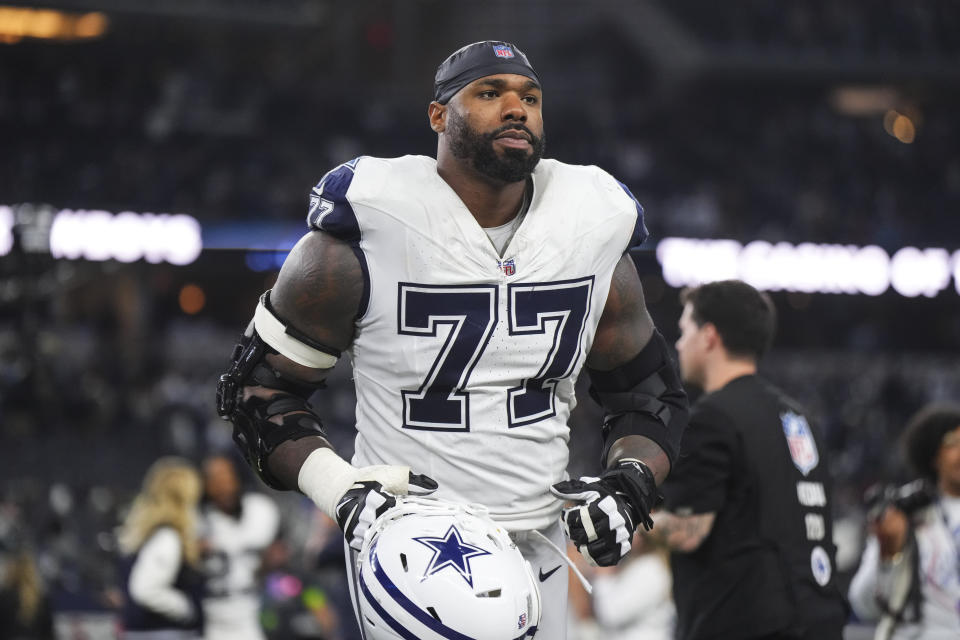 ARLINGTON, TX - DECEMBER 10: Tyron Smith #77 of the Dallas Cowboys walks off of the field after an NFL football game against the Philadelphia Eagles at AT&T Stadium on December 10, 2023 in Arlington, Texas. (Photo by Cooper Neill/Getty Images)