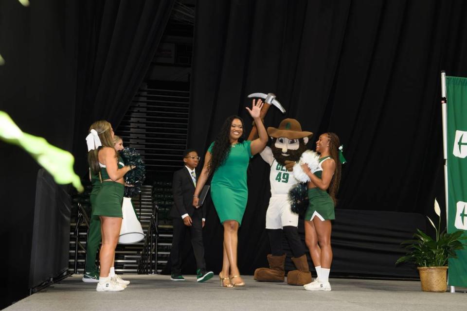 Tomekia Reed enters her introductory press conference as the Charlotte 49ers’ new women’s basketball coach. / Courtesy of Charlotte 49ers athletics