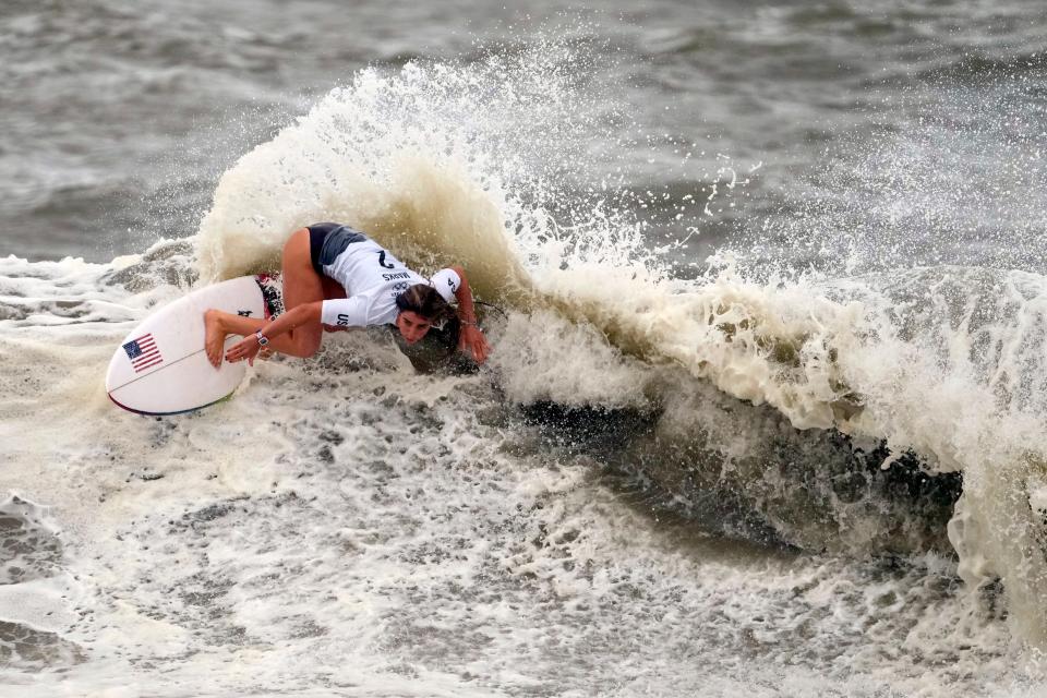 Caroline Marks maneuvers on a wave during the quarterfinals of the women's surfing competition.