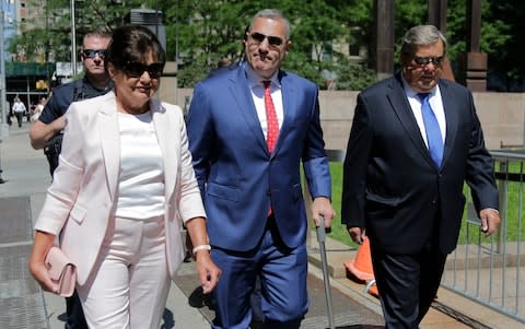 Melania's parents, Viktor and Amalija Knavs, arriving to take the oath of citizenship with their attorney Michael Wildes in New York on Thursday 9 August  - Credit: Seth Wenig/AP