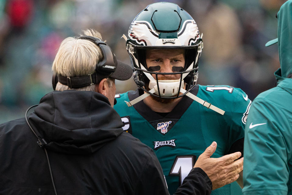 Nov 24, 2019; Philadelphia, PA, USA; Philadelphia Eagles head coach Doug Pederson talks with quarterback Carson Wentz (11) during the third quarter of a game against the Seattle Seahawks at Lincoln Financial Field. Mandatory Credit: Bill Streicher-USA TODAY Sports