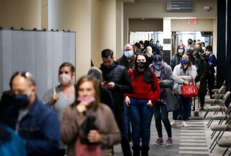 Voters wait in line at Second Baptist Church to cast their vote in the 2020 presidential election on Tuesday, Nov. 3, 2020.