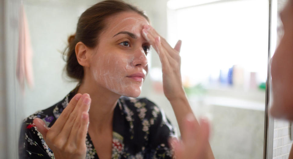 The man's girlfriend, pictured here by a stock image, suffered from an acne outbreak after drinking dairy. [Photo: Getty]
