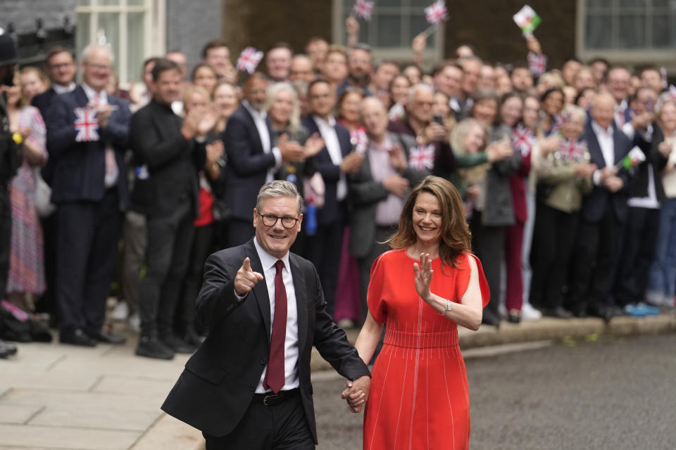 Britain's Labour Party Prime Minister Keir Starmer and his wife Victoria arrive in Downing Street and greet supporters in London, Friday, July 5, 2024. Labour leader Stammer won the general election on July 4, and was appointed Prime Minster by King Charles III at Buckingham Palace, after the party won a landslide victory. (AP Photo/Vadim Ghirda)