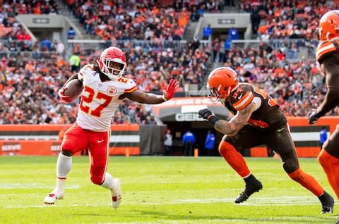 Kansas City Chiefs running back Kareem Hunt (27) pushes Cleveland Browns linebacker Tanner Vallejo (54) away as he runs the ball for a touchdown during the third quarter at FirstEnergy Stadium - Credit: Scott R. Galvin/USA Today