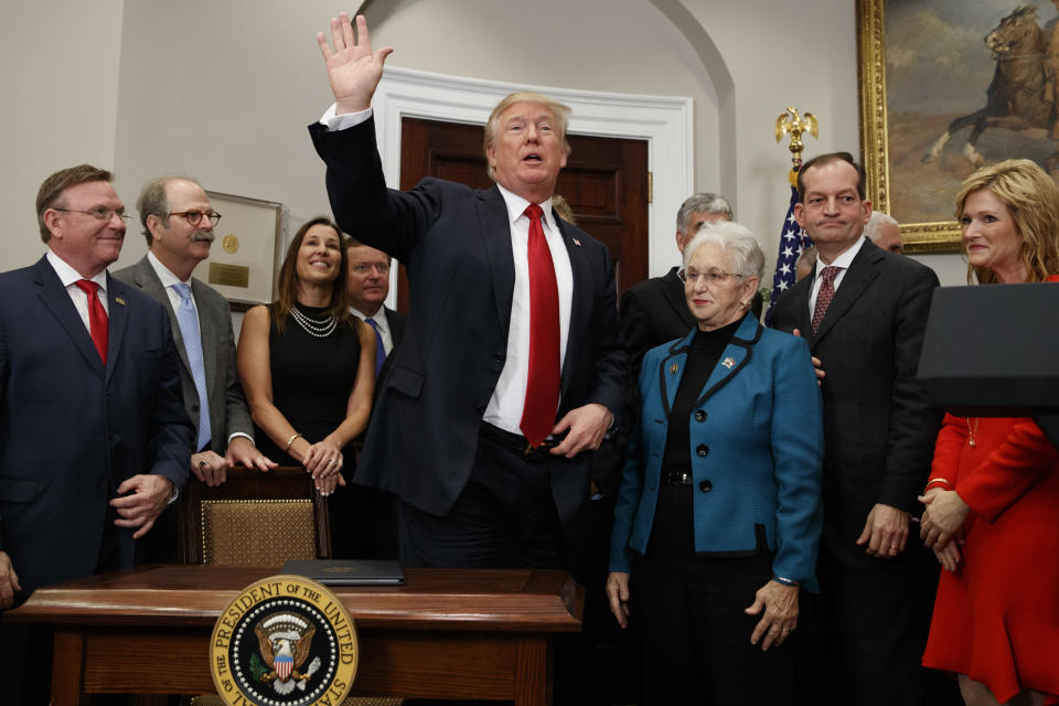 President Donald Trump waves after signing an executive order on health care in the Roosevelt Room of the White House, Oct. 12, 2017, in Washington. (Photo: Evan Vucci/AP)
