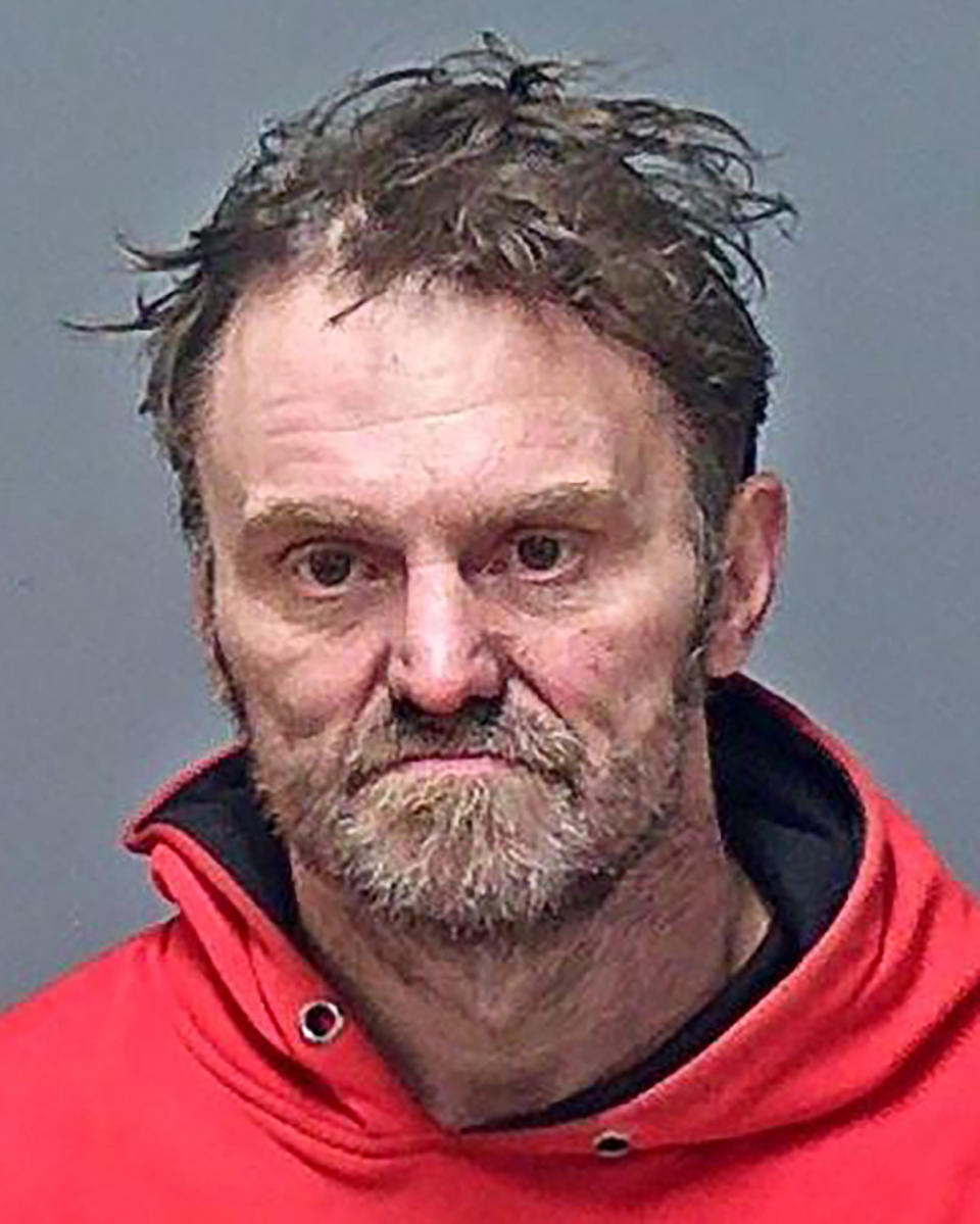 FILE — This booking photo provided by the Manchester Police Department shows George Theberge, who was charged with tampering with witnesses, reckless conduct and endangering the welfare of a child in connection with the Dec. 26, 2022, birth of a child by Alexandra Eckersley, police in Manchester, N.H., said. Theberge, who was sentenced on Monday, Aug. 14, 2023, will spend at least a year in jail for endangering the life of a newborn baby, after MLB Hall of Fame pitcher Dennis Eckersley's daughter gave birth in the woods last year during subfreezing temperatures. (Manchester Police Department via AP, File)