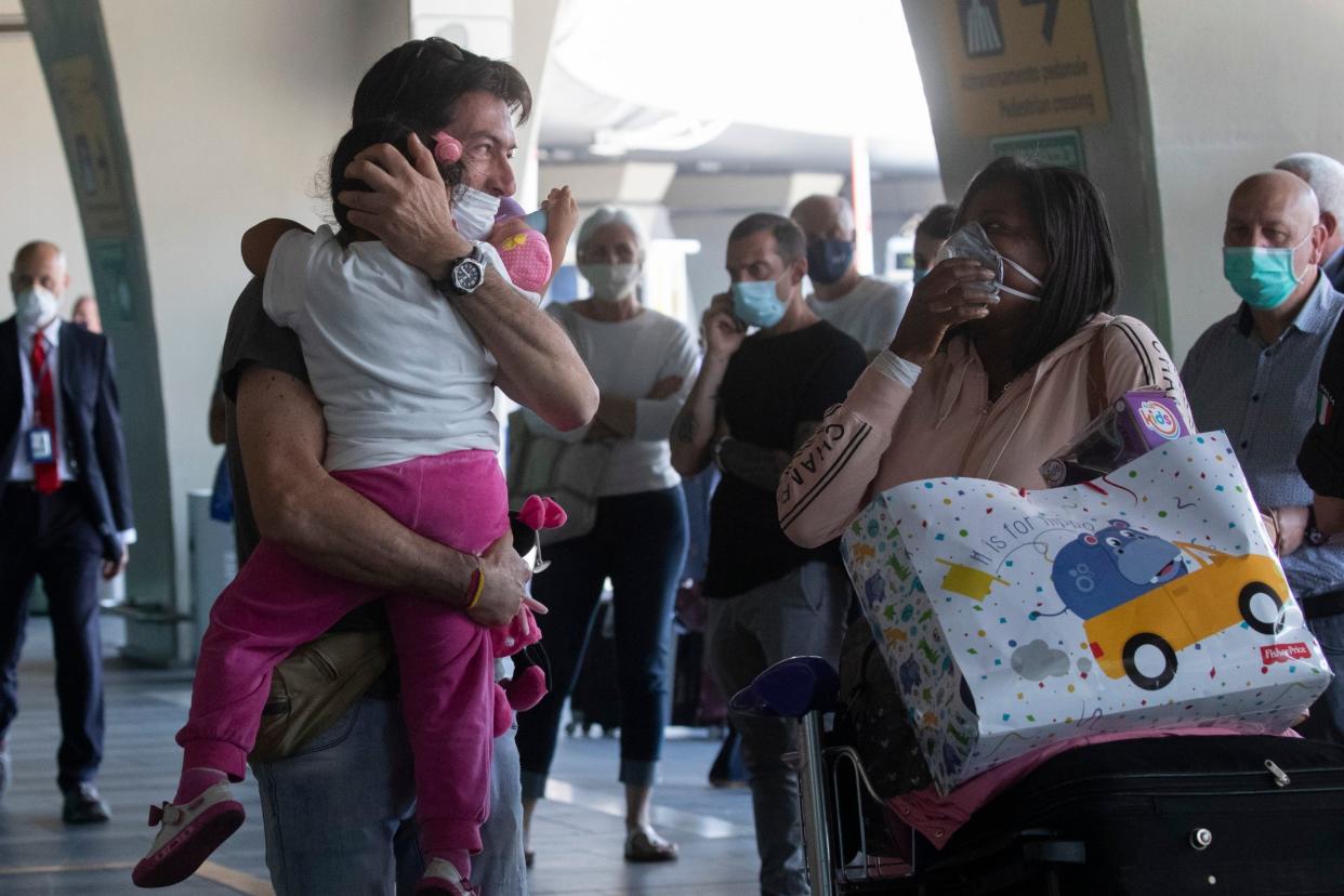 Families reunite at at Rome's Fiumicino airport: AP