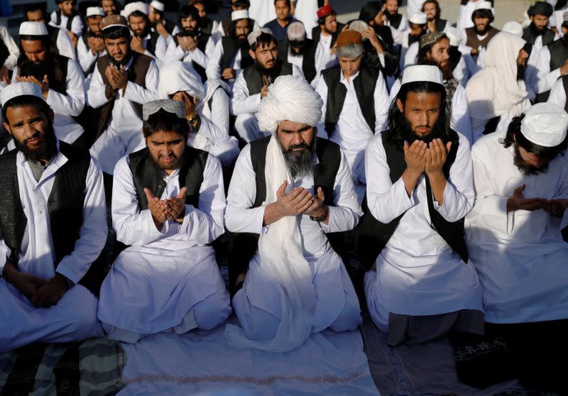 Newly freed Taliban prisoners pray at Pul-i-Charkhi prison, in Kabul, Afghanistan