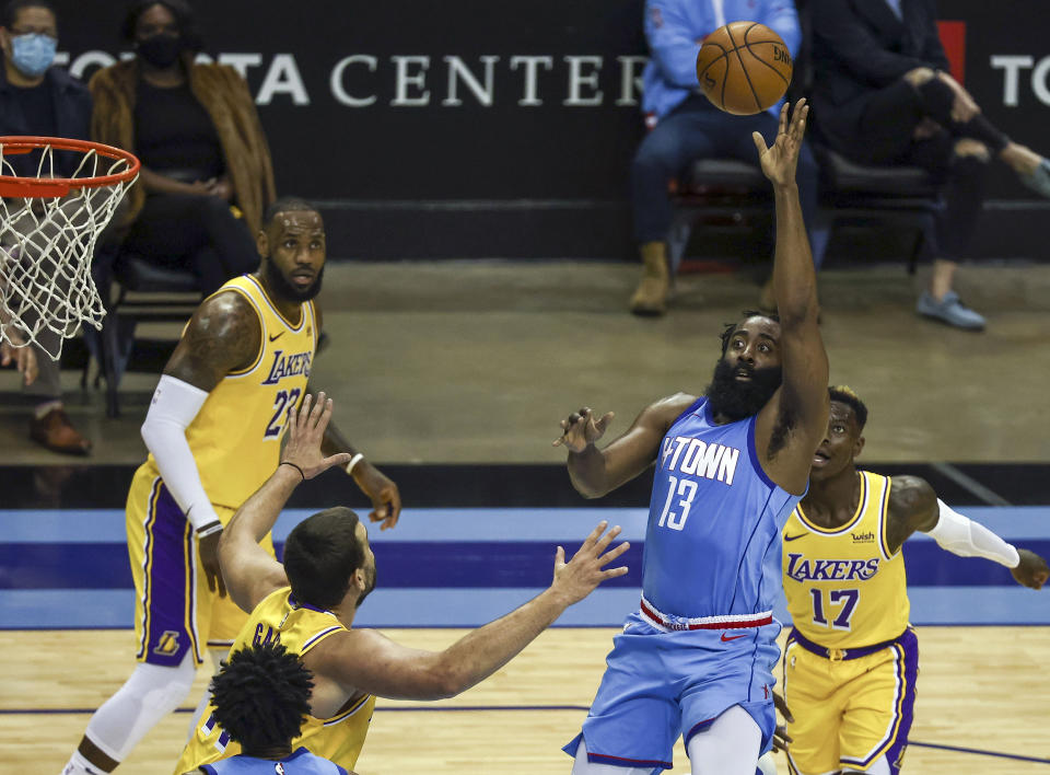 Houston Rockets guard James Harden (13) passes the ball against the Los Angeles Lakers during the third quarter of an NBA basketball game Tuesday, Jan. 21, 2021, in Houston. (Troy Taormina/Pool Photo via AP)