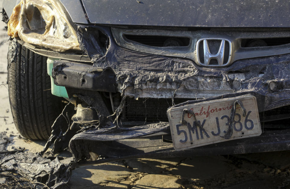 <p>A burned vehicle is seen near Iron Canyon Road in Santa Clarita, Calif., July 25, 2016. (AP Photo/Ringo H.W. Chiu)</p>