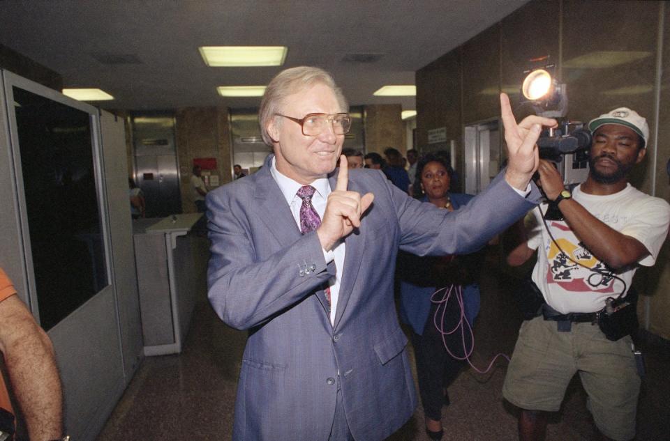 Evangelist Jimmy Swaggart talks with reporters while departing the Civil District Courthouse in New Orleans on Sept. 12, 1991. <a href="https://newsroom.ap.org/detail/JimmySwaggart/29fdcf1ff37046df9617f27f92fffe01/photo?Query=Evangelist%20Jimmy%20Swaggart.%20&mediaType=photo&sortBy=&dateRange=Anytime&totalCount=31&currentItemNo=10" rel="nofollow noopener" target="_blank" data-ylk="slk:AP Photo/Bill Haber;elm:context_link;itc:0;sec:content-canvas" class="link ">AP Photo/Bill Haber</a>
