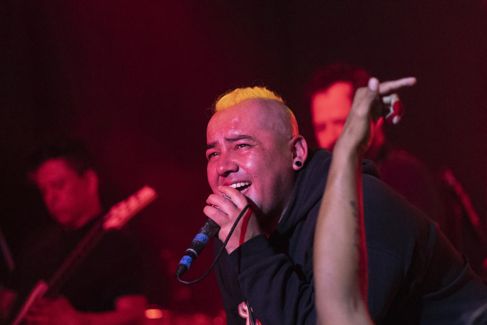 Abraham “Muñeko” Torres, the vocalist of the Mexican Ska band Nana Pancha, performs during one of the last active weekends at the iconic counterculture venue Multiforo Alicia in Mexico City, Friday, Feb. 10, 2023. "Muñeko” first played at the Alicia when he was 16-years-old. (AP Photo/Eduardo Verdugo)