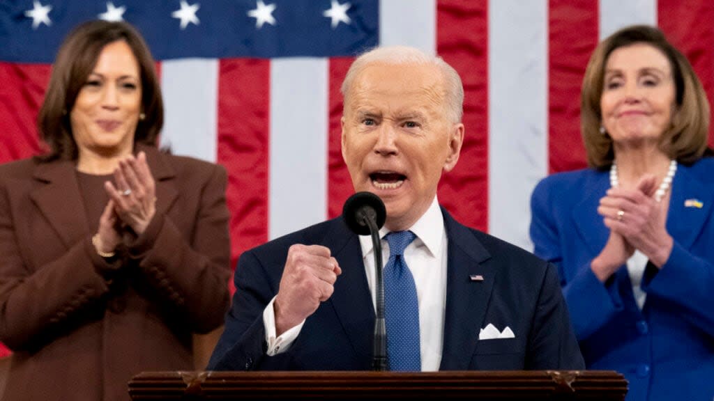 US President Joe Biden delivers the State of the Union address as U.S. Vice President Kamala Harris (L) and House Speaker Nancy Pelosi (D-CA) look on during a joint session of Congress in the U.S. Capitol House Chamber on March 1, 2022 in Washington, DC. (Photo by Saul Loeb – Pool/Getty Images)