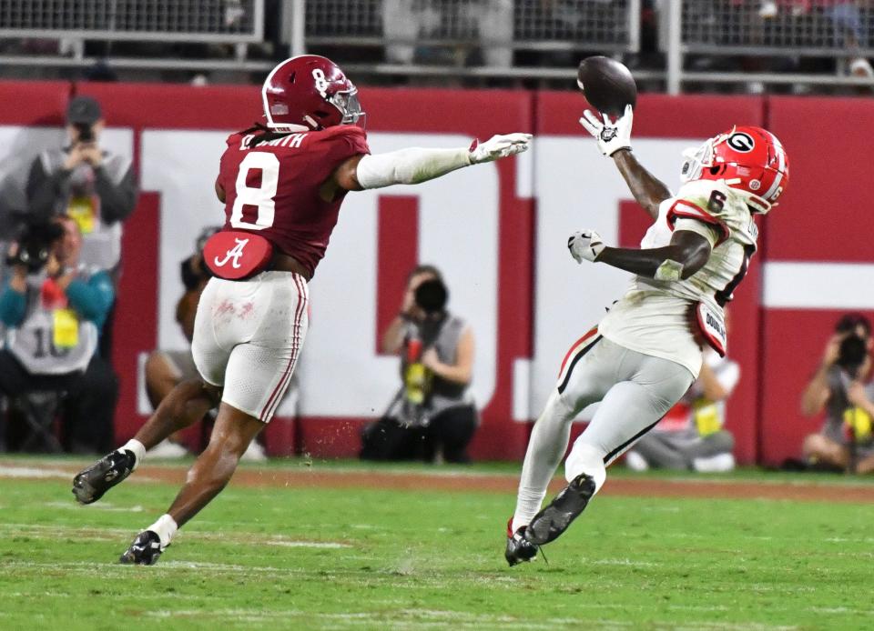 Sep 28, 2024; Tuscaloosa, Alabama, USA; Alabama Crimson Tide defensive back DeVonta Smith (8) defends on a pass to Georgia Bulldogs wide receiver Dominic Lovett (6) at Bryant-Denny Stadium. Alabama defeated Georgia 41-34. Mandatory Credit: Gary Cosby Jr.-Imagn Images