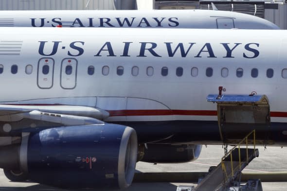 One hospitalised after US airways plane makes emergency landing without its nose gear