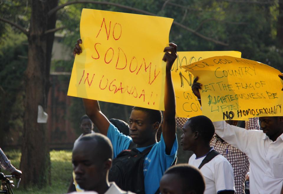 Anti-Homosexual activists march on the streets of Kampala carrying placards on August 11, 2014.