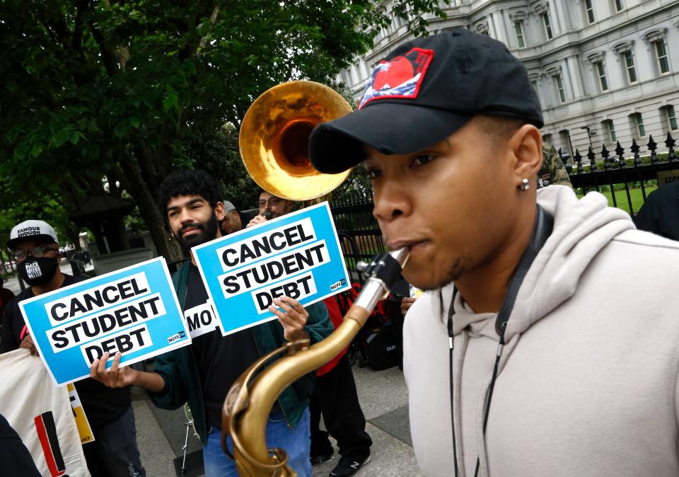 Student loan borrowers gather near the White House to tell President Joe Biden to cancel student debt on May 12, 2020, in Washington, D.C. (Photo by Paul Morigi/Getty Images for We, The 45 Million)