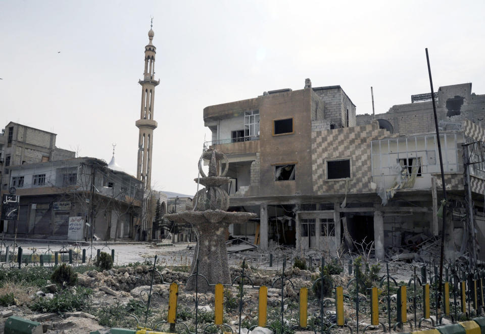 This photo released by the Syrian official news agency SANA, shows damaged building in the town of Yabroud, Syria, Sunday, March. 16, 2014. Syrian troops backed by Hezbollah fighters seized a key rebel supply town on the Lebanese border on Sunday, driving them from the area and scoring a major blow against them in the three-year-old-conflict. (AP Photo/SANA)