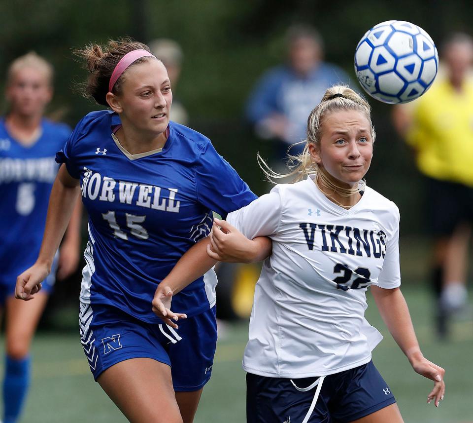 Norwell's Reagan Dowd, left, and East Bridgewater's Kylie Conway chase down a loose ball. The Clippers and Vikings played to a 2-2 tie at Norwell on Monday, Sept. 12, 2022.