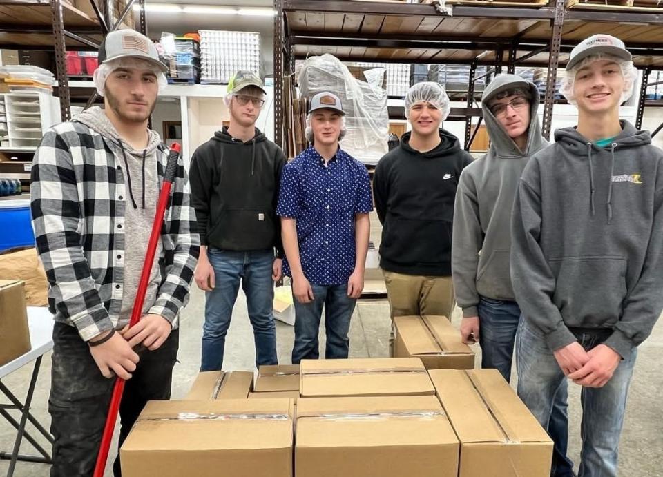 Northwestern FFA students help with soup packaging at Harvest Call Distribution Center in Sterling.