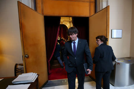 Catalan regional President Carles Puigdemont leaves a debate in the Catalonian regional Parliament in Barcelona, Spain, September 7, 2017. REUTERS/Albert Gea