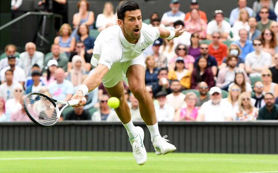 Novak Djokovic of Serbia aims for a forehand during his men's first round match - Shutterstock