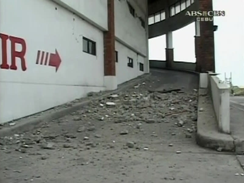 Still image of debris seen on the ground after an earthquake which caused the collapse of several buildings in Cebu City