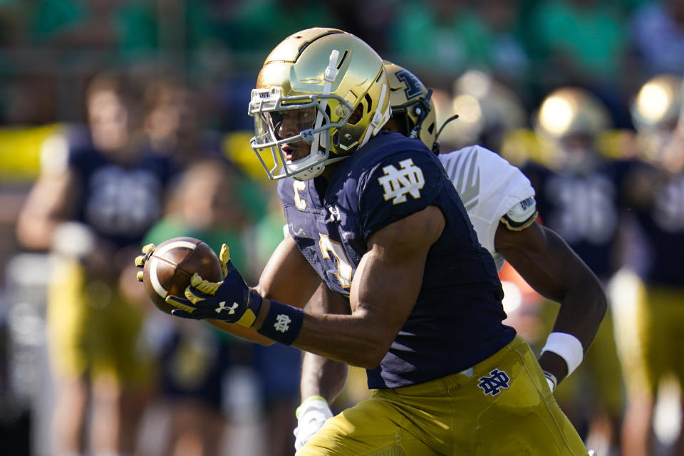 Notre Dame wide receiver Avery Davis (3) makes a catch on his way to a touchdown against Purdue during the second half of an NCAA college football game in South Bend, Ind., Saturday, Sept. 18, 2021. Notre Dame defeated Purdue 27-13. (AP Photo/Michael Conroy)