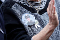 <p>A woman wearing a button of late United Airlines Flight 93 Captain Jason Dahl applauds during the 17th annual September 11 observance at the Flight 93 National Memorial near Shanksville, Pa., Sept. 11, 2018. (Photo: Kevin Lamarque/Reuters) </p>